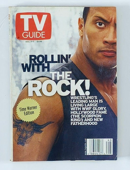 TV Guide Magazine December 1 2001 featuring Dwayne Johnson, known as The Rock, on the cover. This edition showcases his rise in Hollywood and includes themes of wrestling and family.