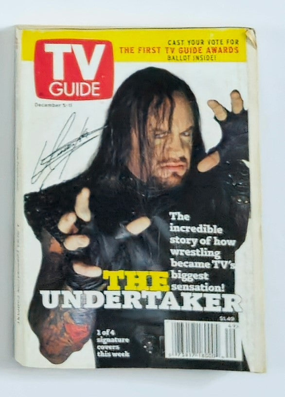 TV Guide Magazine December 5 1998 featuring WWF The Undertaker on the cover. The magazine highlights the incredible story of how wrestling became television's biggest sensation, showcasing The Undertaker's iconic presence in professional wrestling.