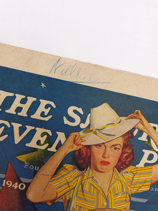 Close-up view of the cover of The Saturday Evening Post from June 22, 1940, highlighting a woman in a striped shirt and hat with a handwritten note above.