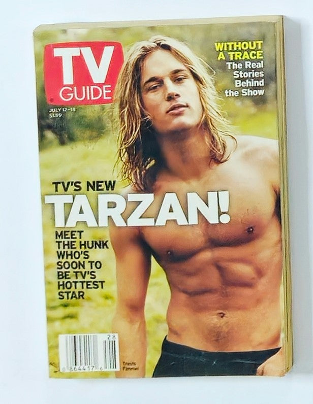 TV Guide Magazine July 12 2003 featuring Travis Fimmel as the cover star, showcasing him shirtless, promoting the television series 'Tarzan'.