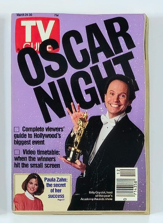 TV Guide Magazine cover from March 24, 1990 featuring Billy Crystal celebrating Oscar Night, holding an Oscar trophy, with Paula Zahn on the side. The magazine highlights Hollywood's biggest event, showcasing entertainment icons of the early 90s.