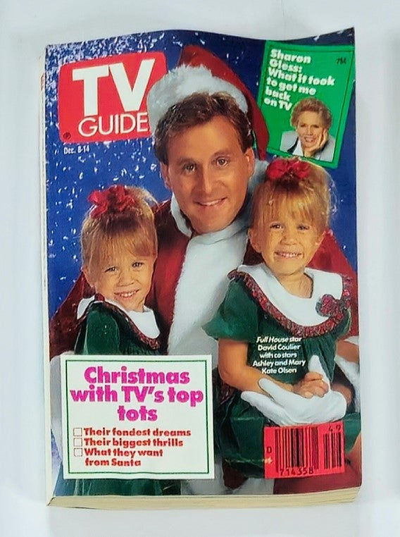 TV Guide Magazine from December 8, 1990 featuring Ashley and Mary Kate Olsen on the cover, alongside actor David Coulier. The cover highlights a festive theme with the twins wearing holiday outfits, and includes the tagline 'Christmas with TV's top tots.' This vintage magazine is a collectible for fans of 90s pop culture and television history.