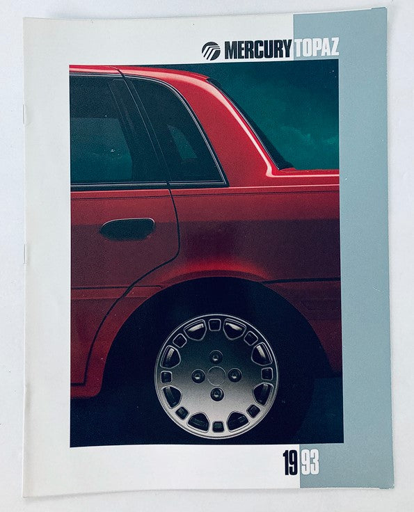 1993 Mercury Topaz Car Dealer Showroom Sales Brochure featuring a close-up of the car's design with a red exterior and alloy wheel, showcasing the vehicle's stylish profile.