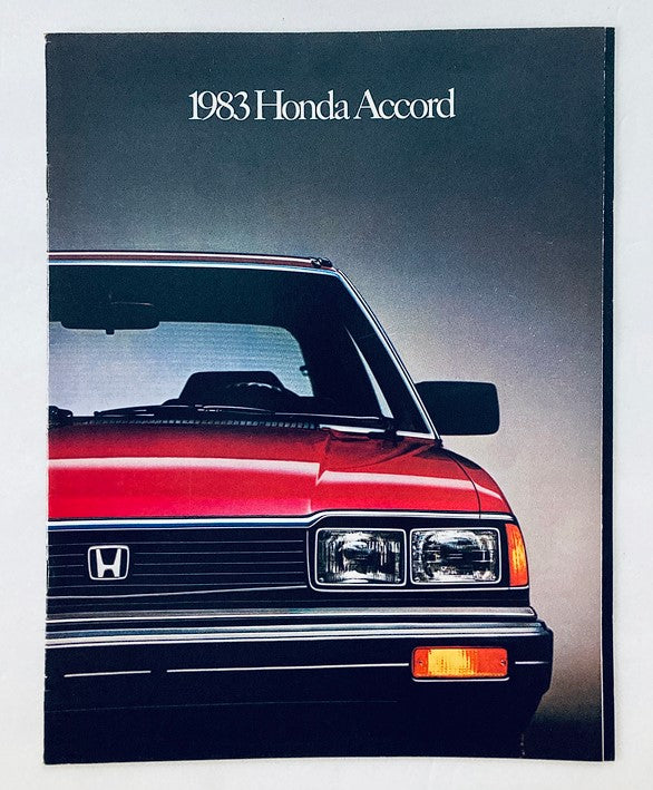 Cover of the 1983 Honda Accord Car Dealer Showroom Sales Brochure Guide Catalog featuring a close-up view of a red Honda Accord.