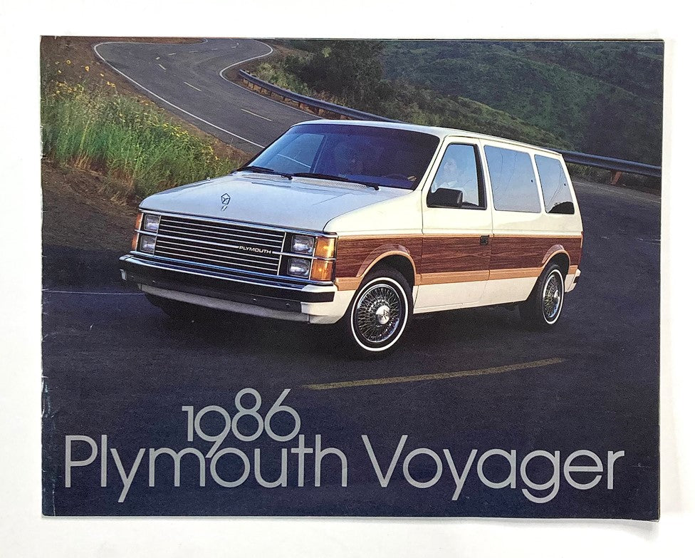 1986 Plymouth Voyager Dealer Showroom Sales Brochure Guide Catalog featuring the classic Plymouth Voyager minivan on a scenic road.