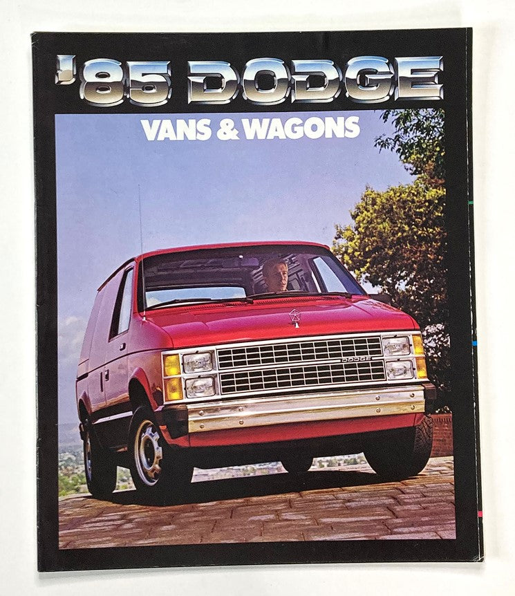 1985 Dodge Vans & Wagons Dealer Showroom Sales Brochure Guide Catalog featuring a red Dodge van parked outdoors, showcasing the vehicle's design and features.