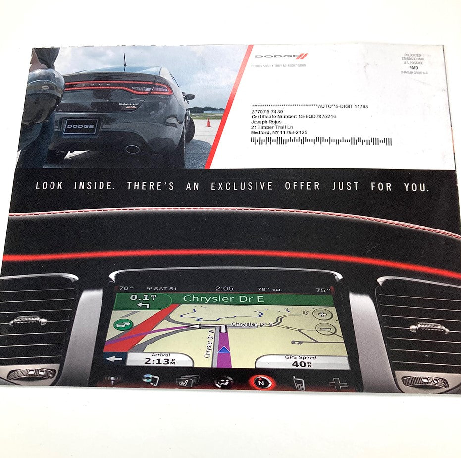 2000s Dodge Dealer Showroom Sales Brochure Guide Catalog showing the interior of a Dodge vehicle with a navigation system and an exclusive offer invitation.