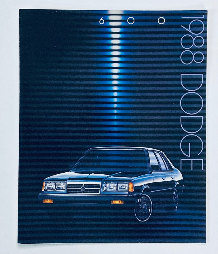 1988 Dodge 600 Dealer Showroom Sales Brochure Guide Catalog featuring a sleek design with a blue and black gradient background and an image of the Dodge 600 model.