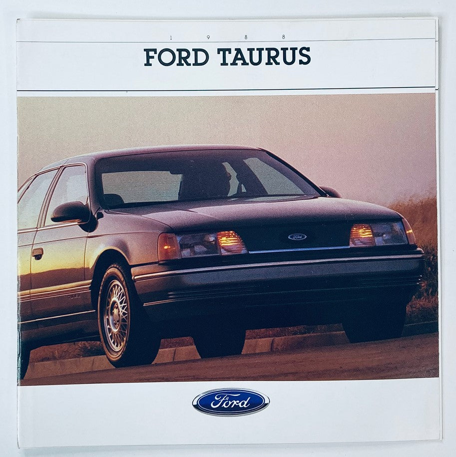 1988 Ford Taurus Dealer Showroom Sales Brochure Guide Catalog featuring a sleek black Ford Taurus parked on a scenic road during sunset.