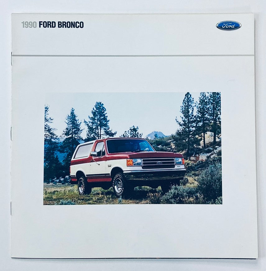 1990 Ford Bronco Dealer Showroom Sales Brochure showcasing a Ford Bronco parked in a scenic outdoor setting, highlighting its design and features.