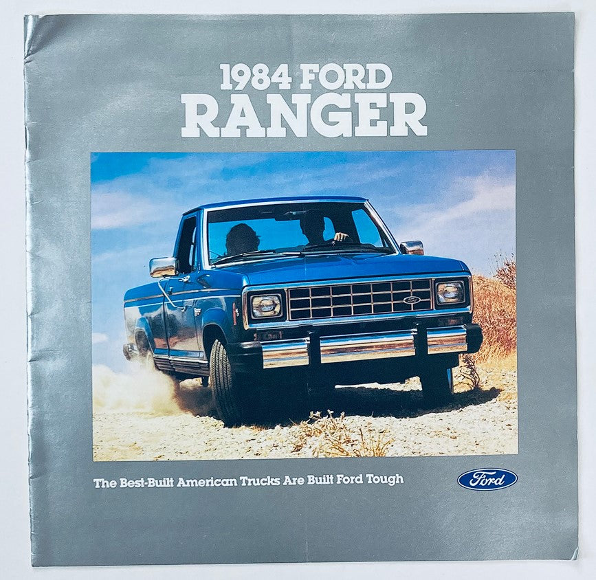 1984 Ford Ranger Dealer Showroom Sales Brochure Cover featuring a blue Ford Ranger truck on a dirt road, promoting the slogan 'The Best-Built American Trucks Are Built Ford Tough'.