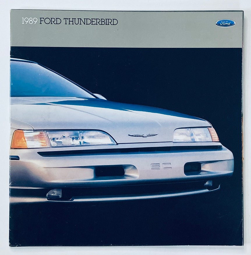 Cover of the 1989 Ford Thunderbird Dealer Showroom Sales Brochure Guide Catalog featuring a close-up of the car's front design showcasing its sleek headlights and distinctive grille.