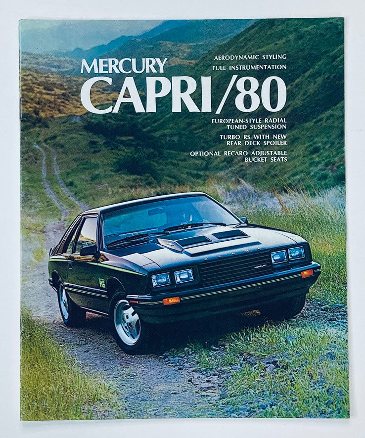 1980 Mercury Capri Dealer Showroom Sales Brochure Guide Catalog featuring a classic black Mercury Capri vehicle on a scenic mountain background, highlighting aerodynamic styling, full instrumentation, and optional features.