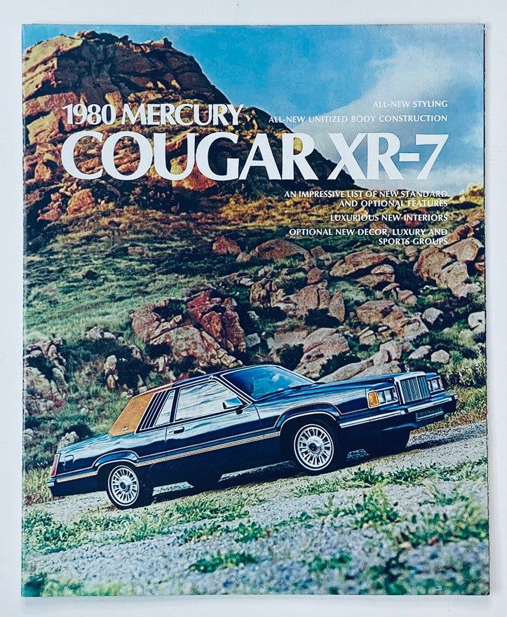 1980 Mercury Cougar XR-7 Dealer Showroom Sales Brochure featuring the car on rugged terrain, showcasing its all-new styling and luxurious features.