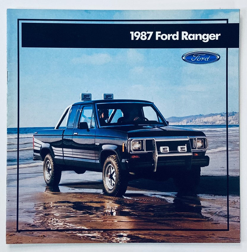 1987 Ford Ranger Dealer Showroom Sales Brochure Guide Catalog featuring a black 1987 Ford Ranger truck on the beach with scenic background, showcasing the vehicle's design and model.