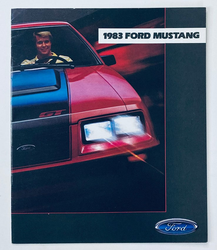 Cover image of the 1983 Ford Mustang Dealer Showroom Sales Brochure Guide Catalog featuring a red Mustang GT with bright headlights against a dark background, capturing the essence of vintage automotive marketing.