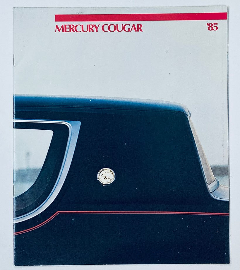 1985 Mercury Cougar Dealer Showroom Sales Brochure Guide Catalog featuring the distinctive rear design and emblem of the Mercury Cougar.