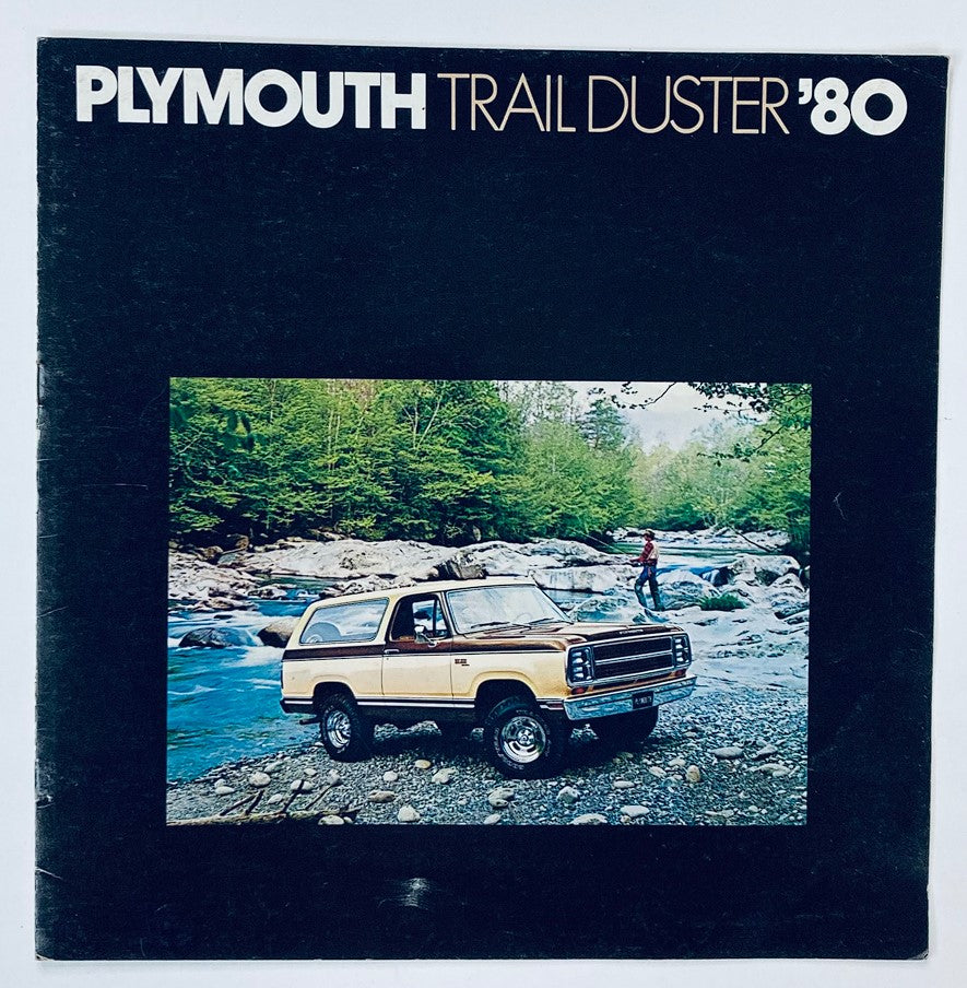 1980 Plymouth Trail Duster Dealer Showroom Sales Brochure featuring a classic Plymouth Trail Duster vehicle by a serene riverside, showcasing the vehicle's rugged design and scenic backdrop.