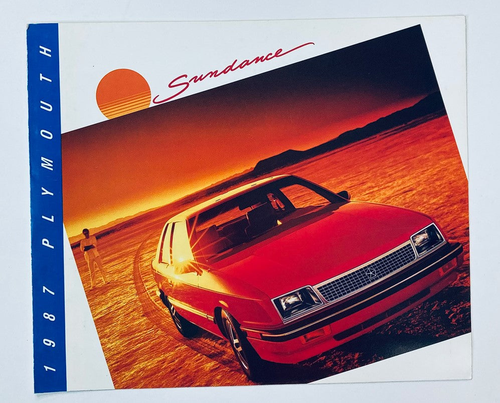 1987 Plymouth Sundance Dealer Showroom Sales Brochure Guide Catalog featuring a vibrant cover with a red Plymouth Sundance car against a striking sunset background.