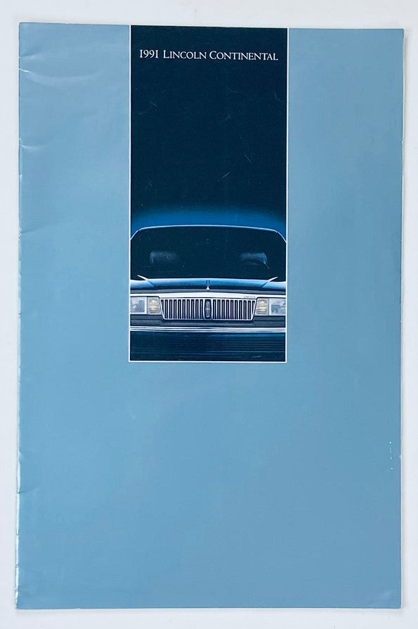 1991 Lincoln Continental Dealer Showroom Sales Brochure Guide Catalog, featuring the sleek front view of the Lincoln Continental on a blue background.