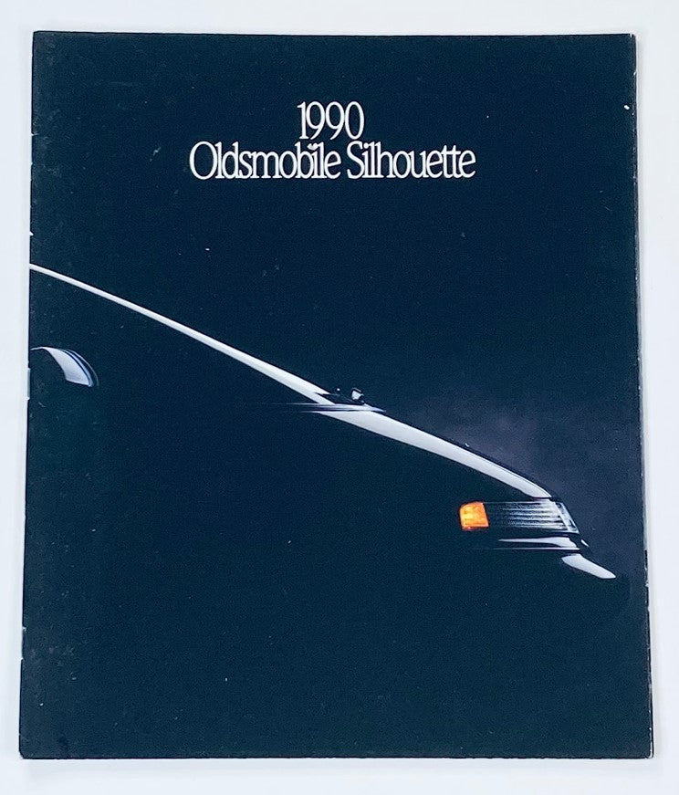 Cover of the 1990 Oldsmobile Silhouette Dealer Sales Brochure Guide Catalog featuring a silhouette of the vehicle against a dark background.