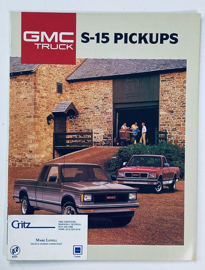 1984 GMC S-15 Pickup Dealer Showroom Sales Brochure featuring a gray GMC S-15 pickup truck in front of a rustic barn, with two individuals and a truck in the background, showcasing the truck's design and dealership branding.