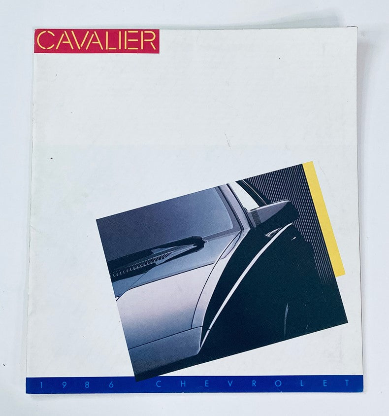 Cover of the 1986 Chevrolet Cavalier Dealer Showroom Sales Brochure Guide Catalog featuring an artistic layout with the word 'CAVALIER' in bold red at the top and an image of the Cavalier car.