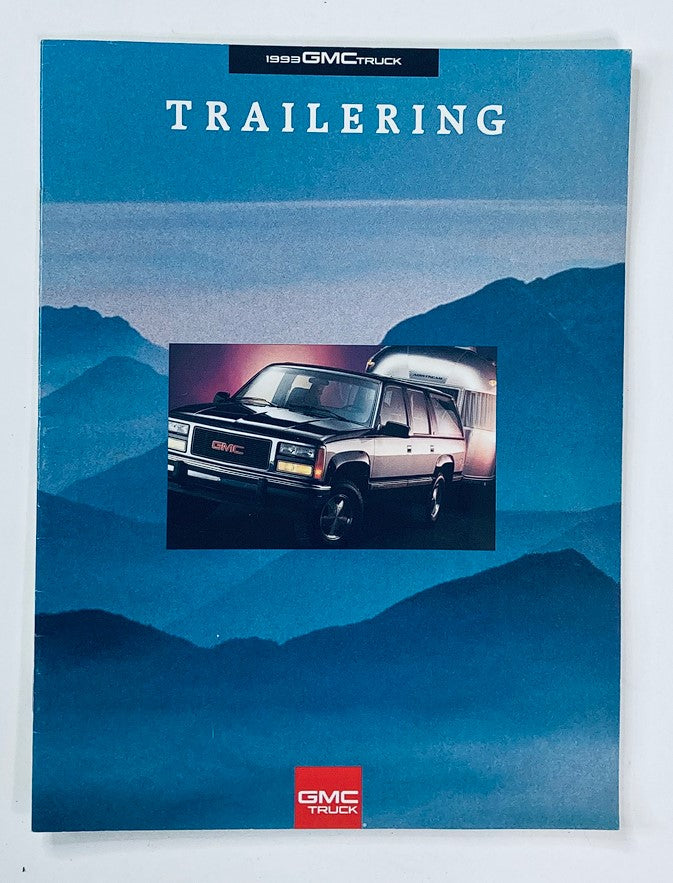 1993 GMC Truck Trailering Dealer Showroom Sales Brochure Guide Catalog cover featuring an image of a GMC vehicle illuminated against a mountainous landscape, highlighting the theme of trailering.