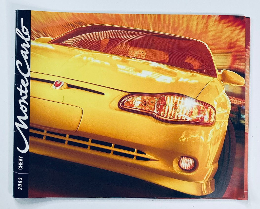2003 Chevrolet Monte Carlo Dealer Showroom Sales Brochure Guide Catalog featuring a dynamic front view of a bright yellow Chevrolet Monte Carlo car.