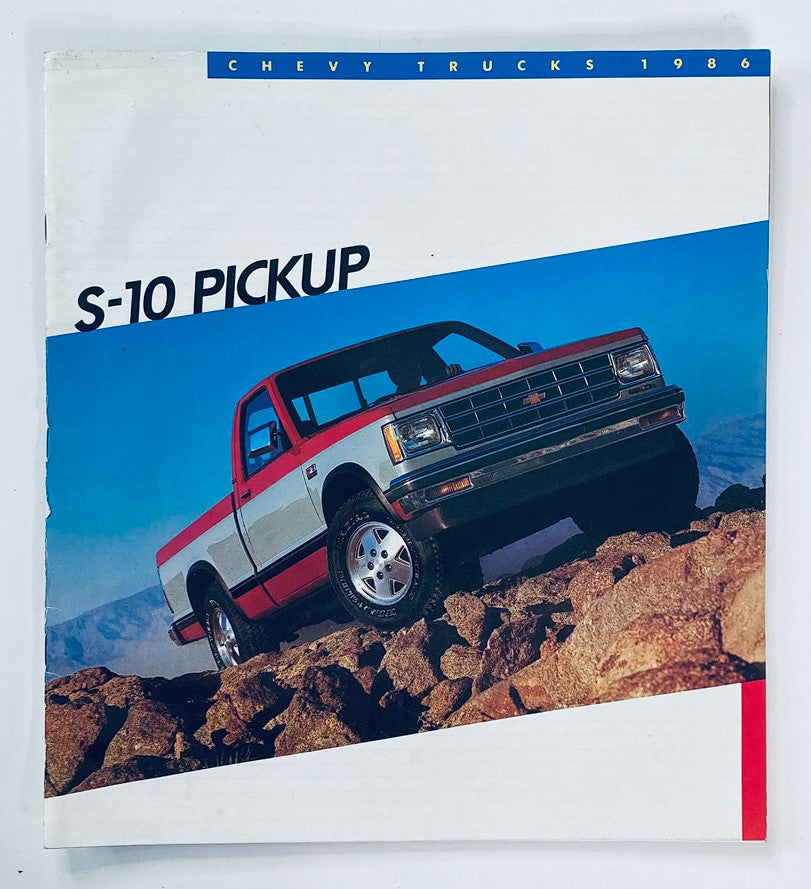 1986 Chevrolet S-10 Pickup Dealer Showroom Sales Brochure showcasing a red and silver pickup truck on rocky terrain, illustrating the design and features of the vehicle.