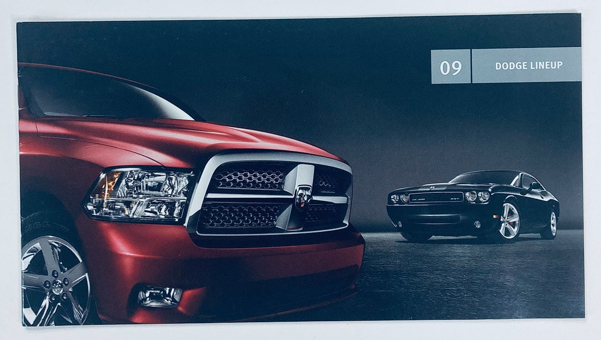 2009 Dodge Lineup Dealer Showroom Sales Brochure Guide Catalog featuring the striking red Dodge pickup truck and a sleek black Dodge Challenger. Ideal for automotive enthusiasts and collectors.