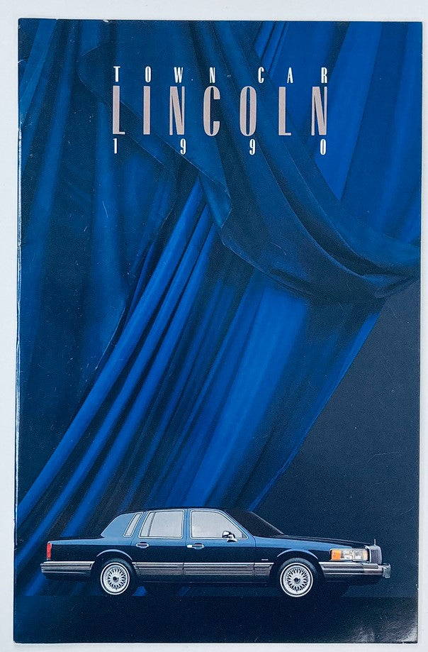 Cover of the 1990 Lincoln Town Car Dealer Showroom Sales Brochure, featuring a sleek black Lincoln Town Car against a blue backdrop.