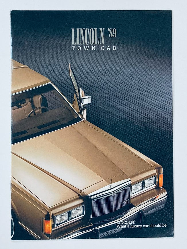 1989 Lincoln Town Car Dealer Showroom Sales Brochure featuring a luxurious gold Lincoln Town Car with an open driver's side door, emphasizing its elegance and design.