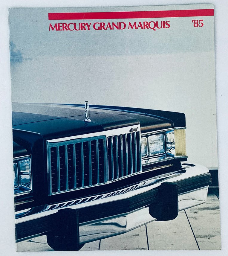 1985 Mercury Grand Marquis Dealer Showroom Sales Brochure featuring the iconic front grille and design of the classic full-size sedan.