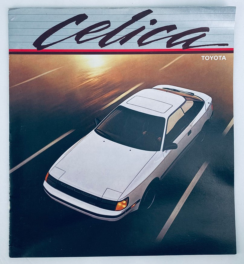 1986 Toyota Celica Dealer Showroom Sales Brochure featuring an image of the white Celica car, showcasing its sporty design against a blurred background, ideal for collectors and automotive enthusiasts.