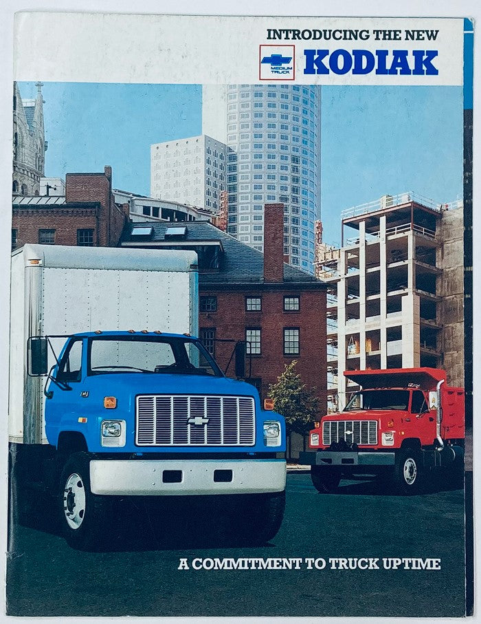 1990 Chevrolet Truck Kodiak Dealer Showroom Sales Brochure featuring a blue and a red Kodiak truck in front of urban buildings, highlighting a commitment to truck uptime.