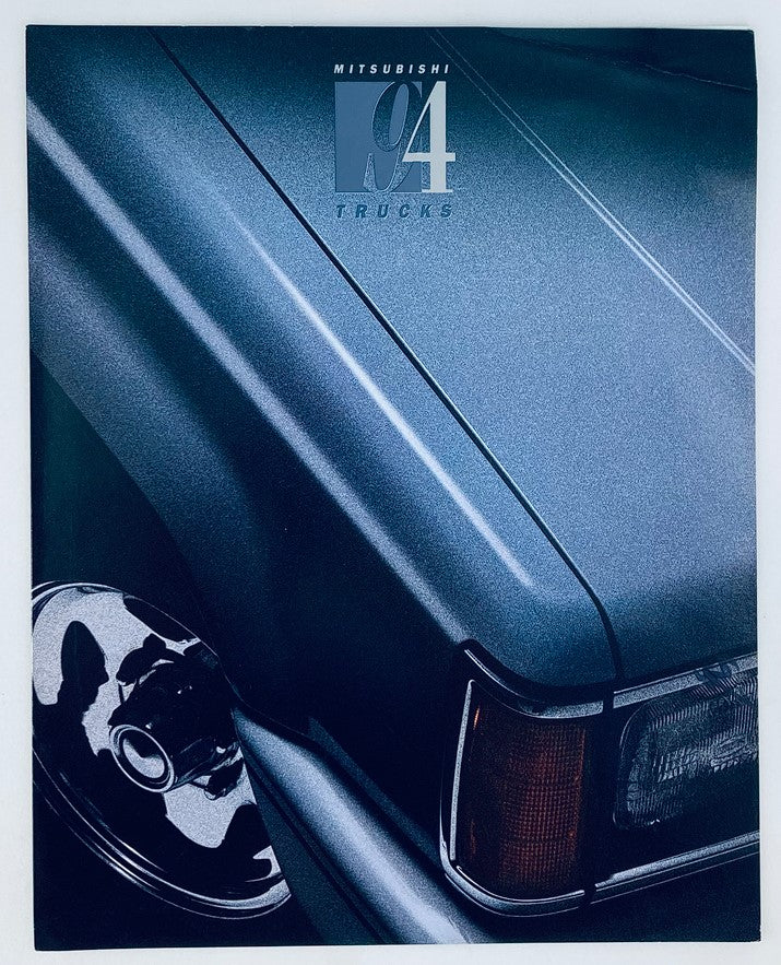 1994 Mitsubishi Trucks Dealer Showroom Sales Brochure Guide Catalog featuring a close-up of a truck's fender and wheel, showcasing the sleek design and glossy finish.