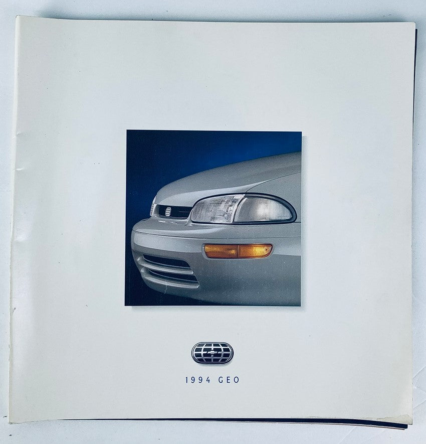 1994 Geo Full Lineup Dealer Showroom Sales Brochure featuring a close-up view of a silver car front, ideal for collectors and enthusiasts.