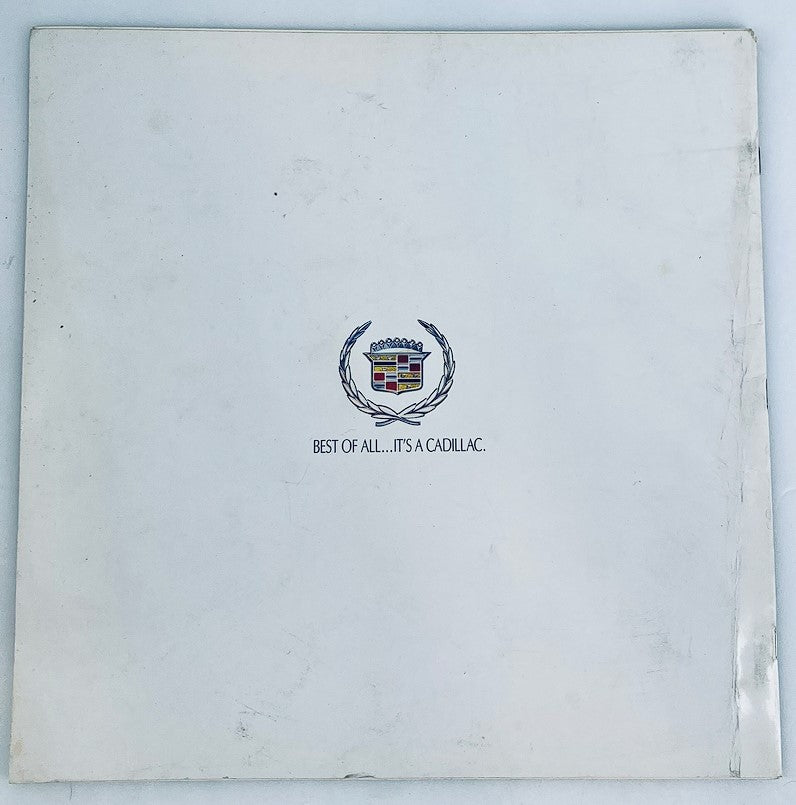 Back cover of the 1986 Cadillac Cimarron Dealer Showroom Sales Brochure Guide Catalog, showcasing the Cadillac logo with the phrase 'BEST OF ALL… IT'S A CADILLAC.'