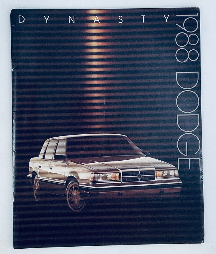 1988 Dodge Dynasty Dealer Showroom Sales Brochure showcasing the front cover with a car image, highlighting its sleek design and brand.