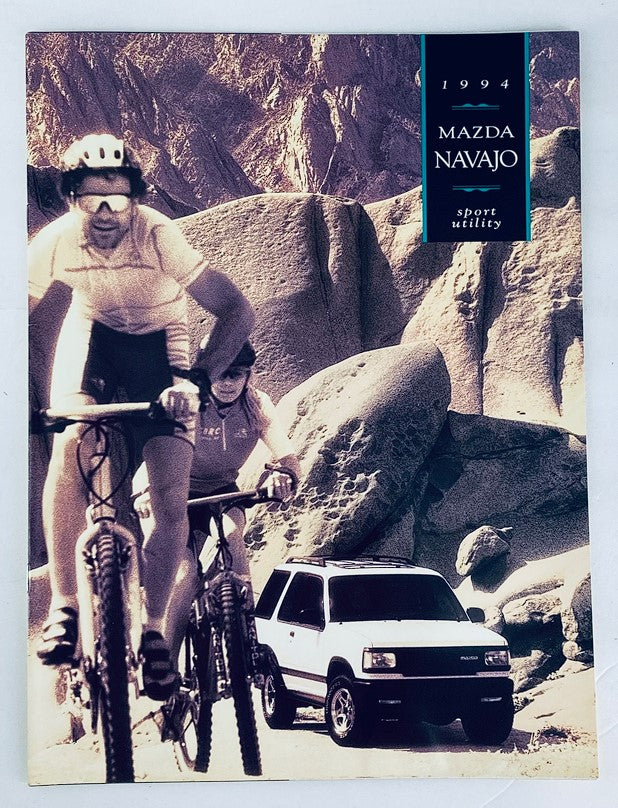 1994 Mazda Navajo Sports Utility Dealer Showroom Sales Brochure featuring the vehicle in an outdoor setting, with mountain bikers in the foreground. Ideal for collectors and Mazda enthusiasts.