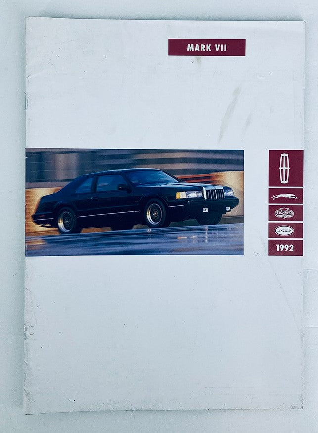 1992 Lincoln Mark VII Dealer Showroom Sales Brochure showcasing a black Lincoln Mark VII car in motion. The catalog cover features the car prominently with the Lincoln logo and 'Mark VII' title.