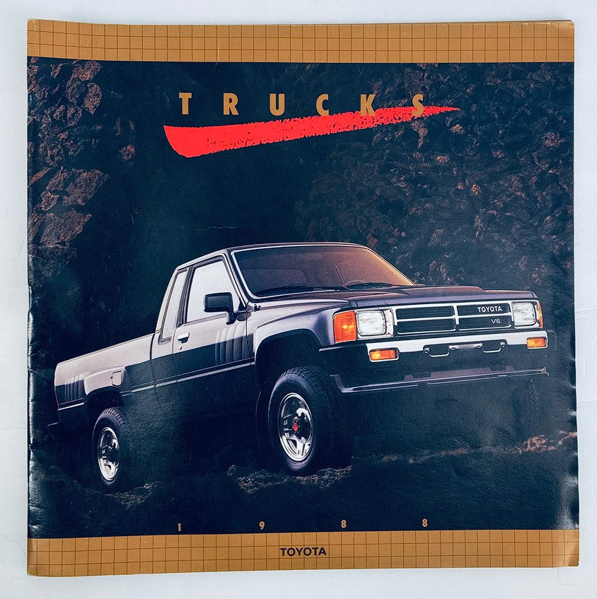 1988 Toyota Trucks Dealer Showroom Sales Brochure Guide Catalog cover featuring a black Toyota truck against a rugged backdrop, highlighting the vehicle's design and features.