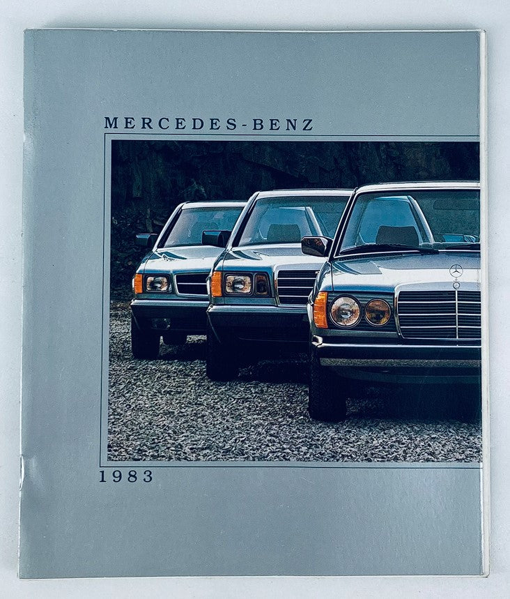 Front cover of the 1983 Mercedes-Benz Lineup Dealer Showroom Sales Brochure Guide Catalog featuring three classic Mercedes-Benz cars parked together.