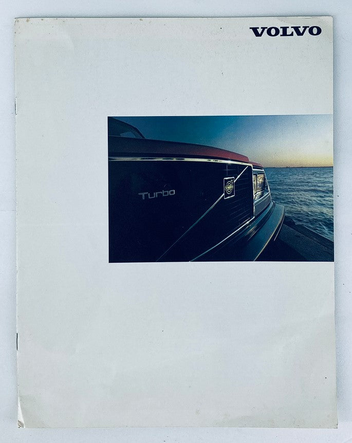 Cover of the 1983 Volvo Turbo Lineup Dealer Showroom Sales Brochure Guide Catalog featuring an artistic view of the Volvo Turbo emblem against a scenic background.