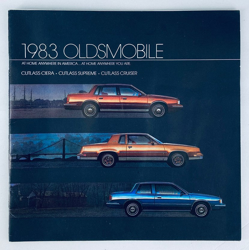 1983 Oldsmobile Cutlass Supreme Dealer Showroom Sales Brochure featuring images of the Cutlass Ciera, Cutlass Supreme, and Cutlass Cruiser models against a dark background.