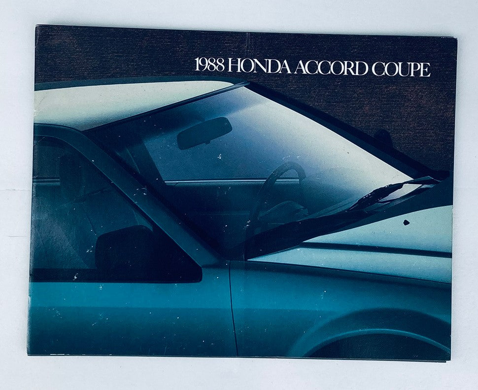 1988 Honda Accord Coupe Dealer Showroom Sales Brochure featuring the exterior view of the vehicle, showcasing its distinctive design and color.