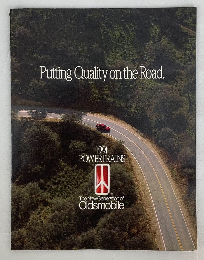 1991 Oldsmobile Powertrains Dealer Showroom Sales Brochure Guide Catalog cover featuring a scenic road and a red Oldsmobile car, highlighting quality and the new generation of Oldsmobile.