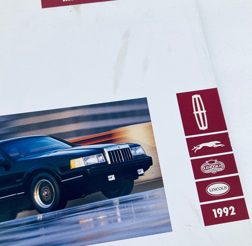 Close-up view of the 1992 Lincoln Mark VII Dealer Showroom Sales Brochure, highlighting the black Lincoln Mark VII car and branding details including the Lincoln logo and model year 1992.