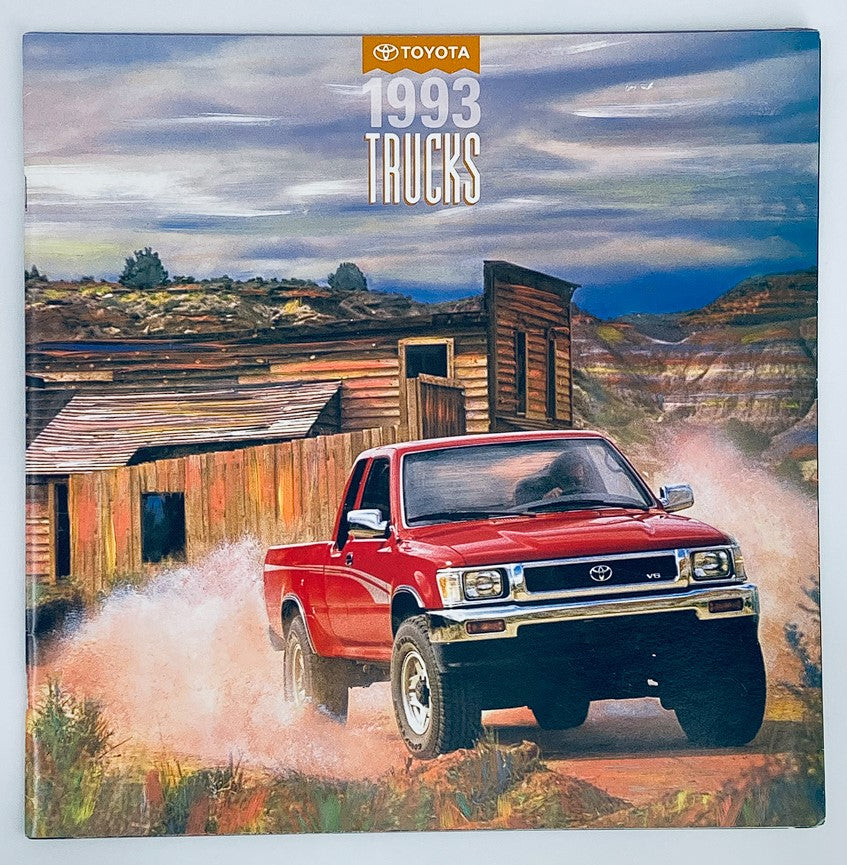 Cover of the 1993 Toyota Trucks Dealer Showroom Sales Brochure featuring a red Toyota truck driving on a dirt road with a rustic background and the title '1993 Trucks' prominently displayed.